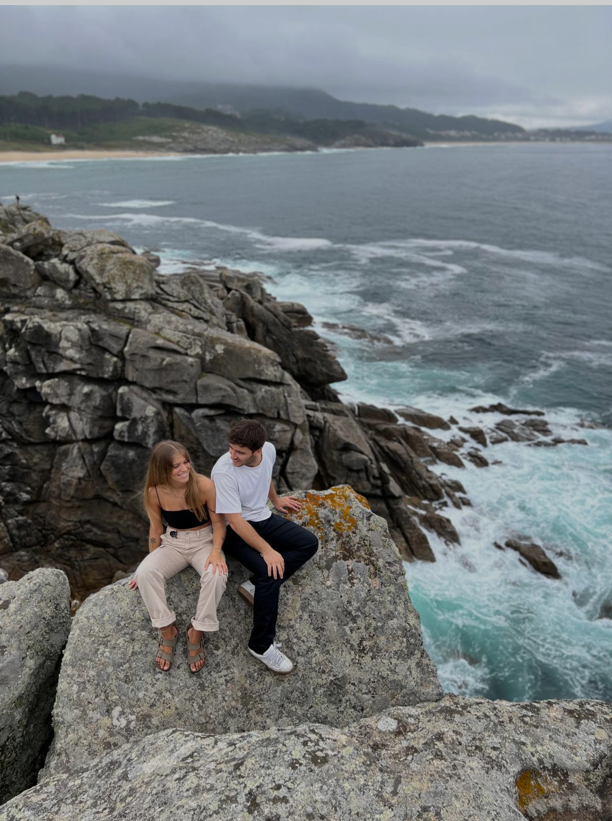 Cropped photo of the exterior of the top floor of an old stone building.